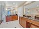 Bathroom featuring dual vanities, large mirrors, and tile floors at 125 E Harmon Ave # 2814/2816, Las Vegas, NV 89109