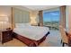 Bedroom features a luxurious bed, city views, and a writing desk at 125 E Harmon Ave # 2814/2816, Las Vegas, NV 89109