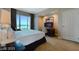 Bedroom features a large bed, large windows, and city views at 125 E Harmon Ave # 2814/2816, Las Vegas, NV 89109