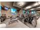 A fitness center with treadmills, weight machines, and natural light offers residents a place to workout at 125 E Harmon Ave # 2814/2816, Las Vegas, NV 89109
