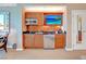 Well-equipped kitchenette with stainless steel appliances, including a microwave, sink, and mini-refrigerator at 125 E Harmon Ave # 2814/2816, Las Vegas, NV 89109