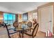 Cozy living area with a glass table, comfortable chairs and sweeping city views from the large windows at 125 E Harmon Ave # 2814/2816, Las Vegas, NV 89109