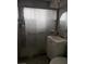 Tiled shower and single vanity in a modern bathroom at 1331 Smoke Tree Ave, Las Vegas, NV 89108