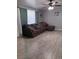 Comfortable living area with plush sofa and modern ceiling fan at 1331 Smoke Tree Ave, Las Vegas, NV 89108