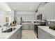 Modern kitchen featuring stainless steel appliances, gray cabinets, and quartz countertops at 147 Harmonica Ave # Lot 24, Henderson, NV 89015