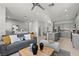 Open concept living room and kitchen with grey furniture, decor, and stainless steel appliances at 147 Harmonica Ave # Lot 24, Henderson, NV 89015