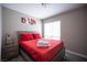 Comfortable bedroom features a decorative piece and a bedside table at 1511 Living Desert Dr # C, Las Vegas, NV 89119