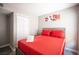 Bedroom with a comfortable bed with red linens and a decorative piece at 1511 Living Desert Dr # C, Las Vegas, NV 89119