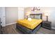 Comfortable bedroom with a wooden bed frame, stylish lamps, and neutral decor at 1511 Living Desert Dr # C, Las Vegas, NV 89119
