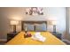Inviting bedroom setup with wine, towels and decorative pillows on a queen size bed at 1511 Living Desert Dr # C, Las Vegas, NV 89119