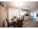 Charming dining area with stylish decor, table for four, and bright lighting at 1511 Living Desert Dr # C, Las Vegas, NV 89119
