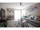 Comfortable living room with plush gray couch, contemporary decor, and natural light at 1511 Living Desert Dr # C, Las Vegas, NV 89119