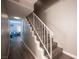 Stairway leading up to the next level with wooden steps and white railing at 1511 Living Desert Dr # C, Las Vegas, NV 89119