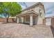 Backyard with brick pavers, covered patio, and block wall at 1733 Gentle Brook St, North Las Vegas, NV 89084
