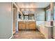 Bathroom featuring double sinks, garden tub, and glass shower at 1733 Gentle Brook St, North Las Vegas, NV 89084