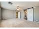 Bedroom featuring a barn door, closet and carpet flooring at 1733 Gentle Brook St, North Las Vegas, NV 89084