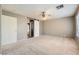Bedroom featuring a white sliding barn door and carpet flooring at 1733 Gentle Brook St, North Las Vegas, NV 89084