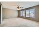 Spacious bedroom with two large windows and a ceiling fan at 1733 Gentle Brook St, North Las Vegas, NV 89084
