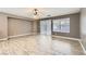 Open-concept living room featuring wood floors, bright windows and neutral wall colors at 1733 Gentle Brook St, North Las Vegas, NV 89084