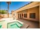 Serene backyard showcasing a spa, built-in grill area, and a pristine pool for ultimate relaxation and outdoor enjoyment at 1742 Sand Storm Dr, Henderson, NV 89074