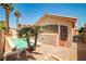 Inviting backyard featuring a refreshing swimming pool and well-manicured landscaping under a bright sky at 1742 Sand Storm Dr, Henderson, NV 89074