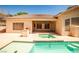 Private backyard oasis boasting a built-in grill, pristine pool, and relaxing spa for ultimate outdoor enjoyment at 1742 Sand Storm Dr, Henderson, NV 89074