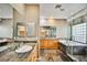 Bright primary bathroom featuring a tub, shower, and dual sinks with granite countertops at 1742 Sand Storm Dr, Henderson, NV 89074