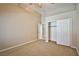 A large bedroom includes a walk in closet and is painted with neutral colors and carpeted at 1742 Sand Storm Dr, Henderson, NV 89074