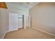 Neutral carpeted bedroom with walk-in closet and white doors at 1742 Sand Storm Dr, Henderson, NV 89074