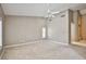 Spacious bedroom with high ceilings, carpet, and shuttered windows at 1742 Sand Storm Dr, Henderson, NV 89074