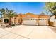 Attractive single-story home with a three-car garage and well-maintained desert landscaping at 1742 Sand Storm Dr, Henderson, NV 89074