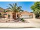 Charming single-story home with a three-car garage and desert landscaping at 1742 Sand Storm Dr, Henderson, NV 89074