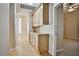 Hallway with wood flooring and built-in storage cabinets, providing practical space and style at 1742 Sand Storm Dr, Henderson, NV 89074