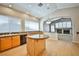 Bright kitchen featuring hardwood floors, granite counters, and stainless steel appliances at 1742 Sand Storm Dr, Henderson, NV 89074