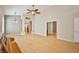 Spacious living area boasting hardwood floors, high ceilings, and open access to other rooms at 1742 Sand Storm Dr, Henderson, NV 89074
