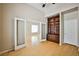 Inviting living area featuring hardwood floors, a built-in bookcase, and a neutral color scheme at 1742 Sand Storm Dr, Henderson, NV 89074
