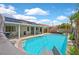 Backyard pool with solar panels, covered patio, slide and desert landscaping offer fun and eco-friendly living at 2011 Mountain Sunset Ave, North Las Vegas, NV 89031