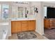 Bright bathroom showcasing a double vanity and tile floor with a view from the tub area at 2011 Mountain Sunset Ave, North Las Vegas, NV 89031