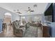 Spacious living room with tile floors, ceiling fans, and comfortable seating, perfect for relaxation at 2011 Mountain Sunset Ave, North Las Vegas, NV 89031