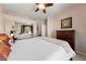 Inviting bedroom with soft lighting, neutral tones, and a mirrored closet at 2050 W Warm Springs Rd # 2822, Henderson, NV 89014