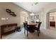 Chic dining area with a modern light fixture, dark wood table set and contemporary décor at 2050 W Warm Springs Rd # 2822, Henderson, NV 89014