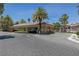 Community entrance featuring a covered parking area and lush landscaping at 2050 W Warm Springs Rd # 2822, Henderson, NV 89014