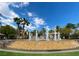 Beautiful water fountain on multiple tiers surrounded by palm trees and landscaping at 2050 W Warm Springs Rd # 2822, Henderson, NV 89014
