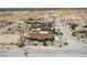 Aerial view of the home and surrounding community in a sparsely populated desert landscape at 2090 S Ambush St, Pahrump, NV 89048
