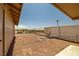 Large backyard surrounded by fences featuring a spot for a fire pit at 2090 S Ambush St, Pahrump, NV 89048