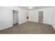Large bedroom features neutral carpet, closet, and doorway to the bathroom at 2090 S Ambush St, Pahrump, NV 89048