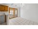 Eat-in kitchen area with tile floors and French doors leading to the outside at 2090 S Ambush St, Pahrump, NV 89048