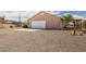 Spacious two-car garage with ample parking space on a large gravel driveway at 2090 S Ambush St, Pahrump, NV 89048