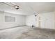 Spacious unfinished garage features bare walls, a single window, and concrete flooring at 2090 S Ambush St, Pahrump, NV 89048