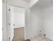 Laundry room with tile floors, white walls, and doorway to carpeted room at 2090 S Ambush St, Pahrump, NV 89048